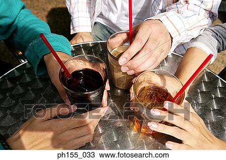High angle view of human's hands holding glasses View Large Photo Image Stock Image - High angle view of human's hands holding glasses. Fotosearch