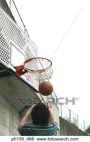 Low angle view of a man making a basket View Large Photo Image Stock Photo - Low angle view of a man making a basket. Fotosearch