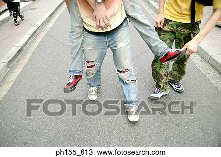 Low section view of a person giving piggy back to another person View Large Photo Image Stock Image - Low section view of a person giving piggy back to another person. Fotosearch