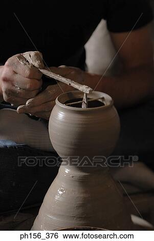 Low section view of a potter making a vase View Large Photo Image Stock Photograph - Low section view of a potter making a vase. Fotosearch