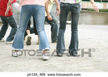 Low section view of five people playing View Large Photo Image Stock Photo - Low section view of five people playing. Fotosearch