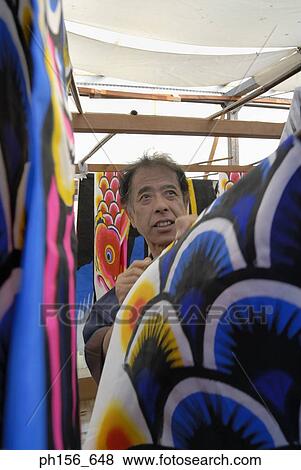 Mid adult man arranging painted sheets in a workshop View Large Photo Image Stock Photo - Mid adult man arranging painted sheets in a workshop. Fotosearch