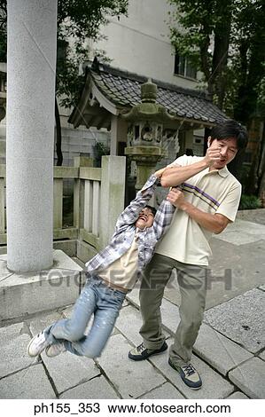 Mid adult man lifting his son View Large Photo Image Stock Image - Mid adult man lifting his son. Fotosearch