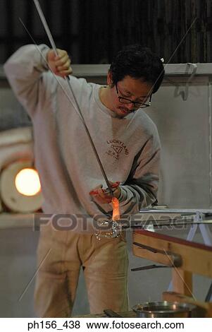 Mid adult man molding a glass bulb View Large Photo Image Stock Photo - Mid adult man molding a glass bulb. Fotosearch