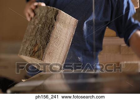 Mid section view of a carpenter working in a workshop View Large Photo Image Stock Image - Mid section view of a carpenter working in a workshop. Fotosearch