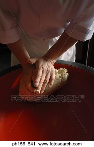 Mid section view of a chef kneading dough View Large Photo Image Stock Image - Mid section view of a chef kneading dough. Fotosearch
