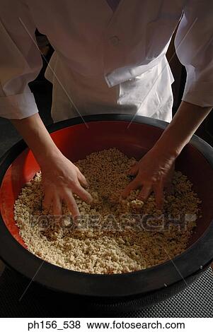 Mid section view of a chef mixing flour View Large Photo Image Stock Photo - Mid section view of a chef mixing flour. Fotosearch
