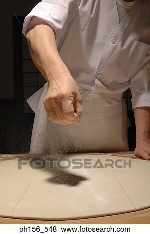 Mid section view of a chef spreading flour on rolled dough View Large Photo Image Stock Photo - Mid section view of a chef spreading flour on rolled dough. Fotosearch