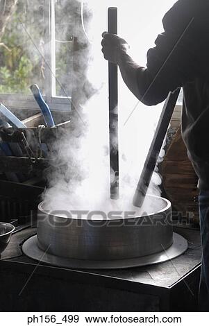 Mid section view of a man working in a workshop View Large Photo Image Stock Photo - Mid section view of a man working in a workshop. Fotosearch