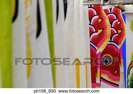 Stock Image - Painted sheets hanging in a workshop. Fotosearch