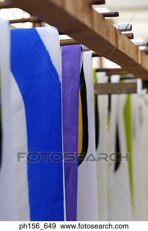 Stock Photo - Painted sheets hanging in a workshop. Fotosearch