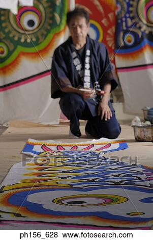 Painter looking at a painted sheet View Large Photo Image Stock Photo - Painter looking at a painted sheet. Fotosearch