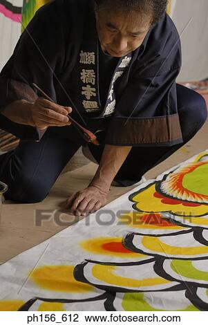 Stock Image - Painter painting on a sheet. Fotosearch