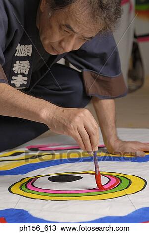 Stock Image - Painter painting on a sheet. Fotosearch