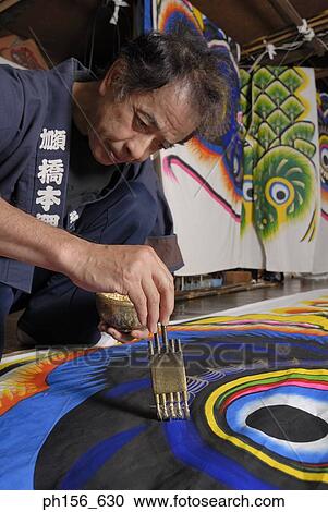 Stock Image - Painter painting on a sheet. Fotosearch