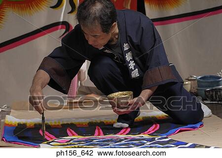 Painter painting on a sheet View Large Photo Image Stock Image - Painter painting on a sheet. Fotosearch