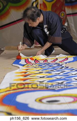 Stock Photograph - Painter painting on a sheet. Fotosearch