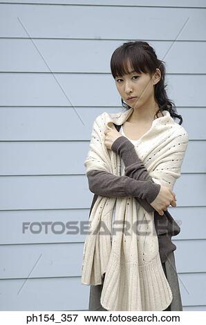 Portrait of a young woman standing View Large Photo Image Stock Photo - Portrait of a young woman standing. Fotosearch