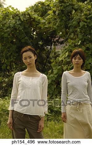 Portrait of two young women View Large Photo Image Stock Photograph - Portrait of two young women. Fotosearch
