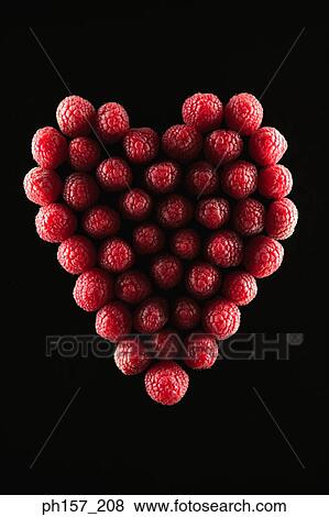 Raspberries in a heart shape View Large Photo Image Stock Photo - Raspberries in a heart shape. Fotosearch
