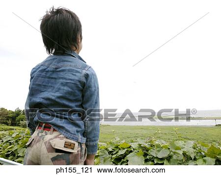 Rear view of a boy View Large Photo Image Stock Image - Rear view of a boy. Fotosearch