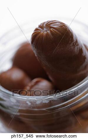 Sausages in a glass container, close-up View Large Photo Image Stock Photography - Sausages in a glass container, close-up. Fotosearch