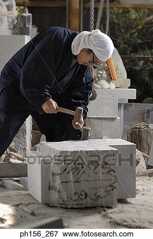 Sculptor carving stone with hammers View Large Photo Image Stock Photo - Sculptor carving stone with hammers. Fotosearch