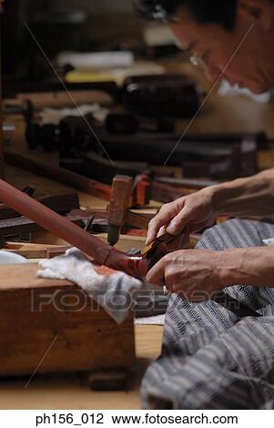 Side profile of a carpenter applying paint on wood View Large Photo Image Stock Image - Side profile of a carpenter applying paint on wood. Fotosearch