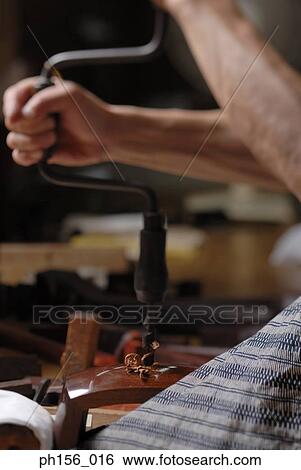 Side profile of a carpenter's hand using a drill View Large Photo Image Stock Photograph - Side profile of a carpenter's hand using a drill. Fotosearch
