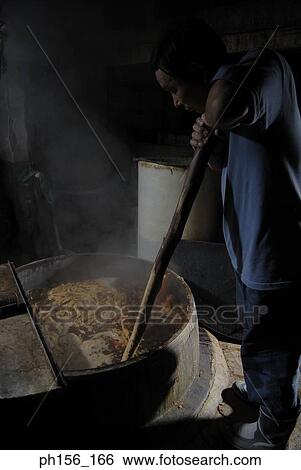 Side profile of a mid adult man boiling animal hide in a container View Large Photo Image Stock Photograph - Side profile of a mid adult man boiling animal hide in a container. Fotosearch