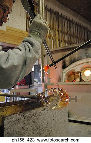 Side profile of a mid adult man molding a glass bulb View Large Photo Image Stock Image - Side profile of a mid adult man molding a glass bulb. Fotosearch