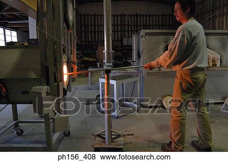 Side profile of a mid adult man molding a glass bulb View Large Photo Image Stock Photo - Side profile of a mid adult man molding a glass bulb. Fotosearch