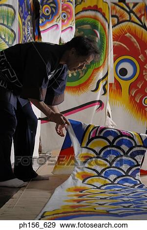 Stock Photo - Side profile of a painter painting. Fotosearch