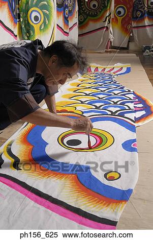 Stock Photography - Side profile of a painter painting. Fotosearch