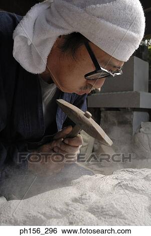 Side profile of a sculptor blowing dust from a stone View Large Photo Image Stock Photograph - Side profile of a sculptor blowing dust from a stone. Fotosearch