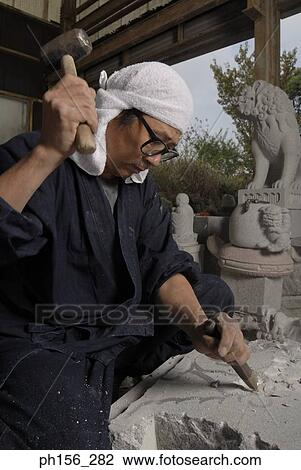 Side profile of a sculptor using a hammer and a chisel on stone View Large Photo Image Stock Image - Side profile of a sculptor using a hammer and a chisel on stone. Fotosearch