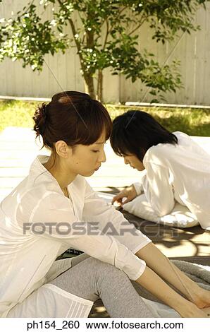 Side profile of a young woman and a young man lying beside her View Large Photo Image Stock Image - Side profile of a young woman and a young man lying beside her. Fotosearch