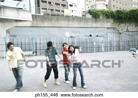 Three young men and a young woman playing View Large Photo Image Stock Photograph - Three young men and a young woman playing. Fotosearch