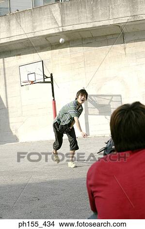 Two young men playing baseball View Large Photo Image Picture - Two young men playing baseball. Fotosearch