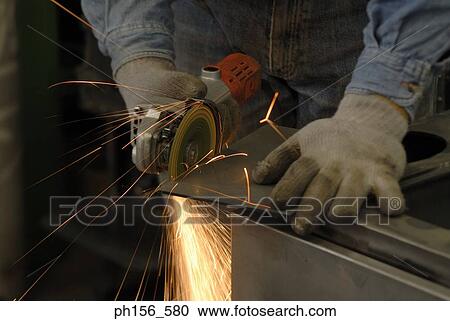 Welder welding in a workshop View Large Photo Image Stock Image - Welder welding in a workshop. Fotosearch