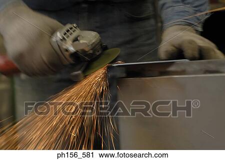 Welder welding in a workshop View Large Photo Image Stock Image - Welder welding in a workshop. Fotosearch