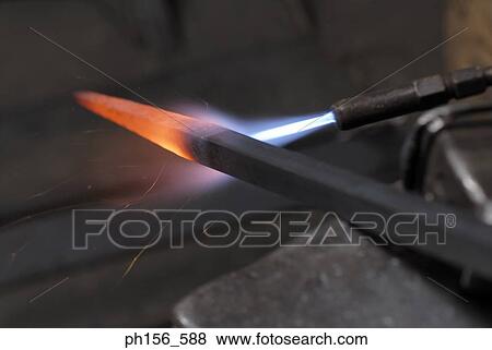 Welding torch heating an iron rod View Large Photo Image Stock Photo - Welding torch heating an iron rod. Fotosearch