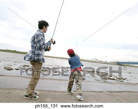 Young man and his son fishing in a river View Large Photo Image Stock Image - Young man and his son fishing in a river. Fotosearch
