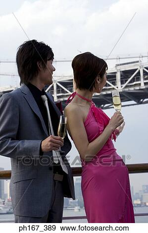 A couple enjoying the view onboard a cruise ship View Large Photo Image Stock Photo - A couple enjoying the view onboard a cruise ship. Fotosearch
