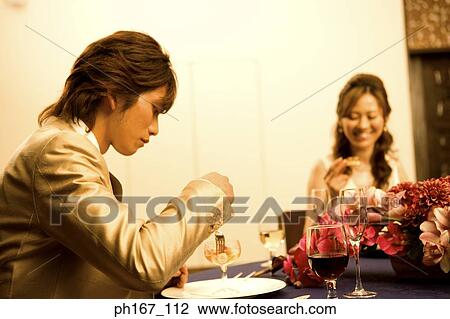 A couple having dinner View Large Photo Image Stock Image - A couple having dinner. Fotosearch