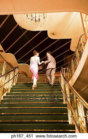 A couple walking up the stairs, rear view View Large Photo Image Stock Image - A couple walking up the stairs, rear view. Fotosearch