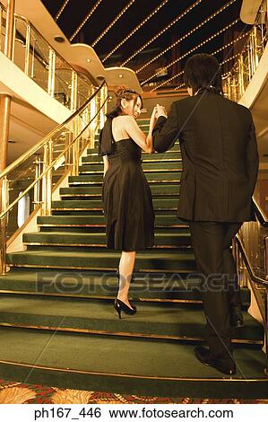 A couple walking up the stairs View Large Photo Image Stock Photograph - A couple walking up the stairs. Fotosearch