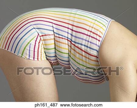 A woman in striped swimsuit, bending forward View Large Photo Image Stock Photo - A woman in striped swimsuit, bending forward. Fotosearch