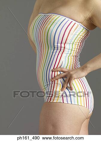 A woman in striped swimsuit, with hands on hips View Large Photo Image Stock Image - A woman in striped swimsuit, with hands on hips. Fotosearch