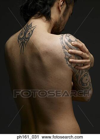 Back of a topless man with tattoos View Large Photo Image Stock Image - Back of a topless man with tattoos. Fotosearch
